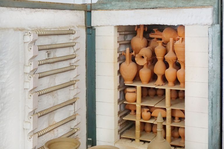A modern chamber type of kiln staked with terracotta pots.